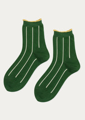 A pair of green socks with vertical white stripes and yellow trim at ankle.