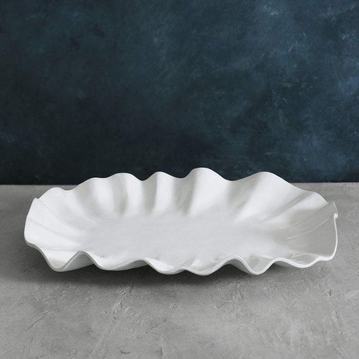 Beatriz Ball Vida Bloom Large Oval Platter — Empty platter on a gray surface