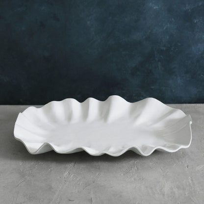 Beatriz Ball Vida Bloom Large Oval Platter — Empty platter on a gray surface