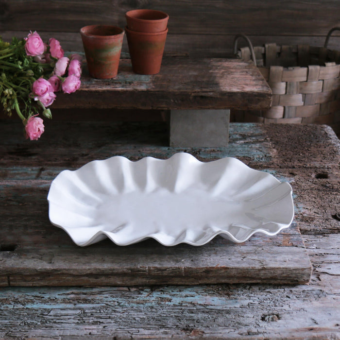 Beatriz Ball Vida Bloom Large Oval Platter — Empty platter on a rustic wooden table